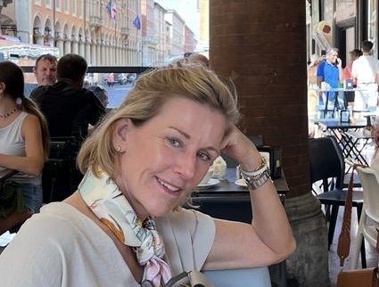 Leslie Lacin at an outdoor café, European city